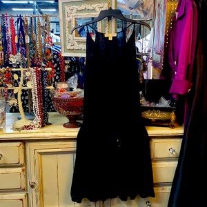 Black Michael Kors short pleaded bottom.